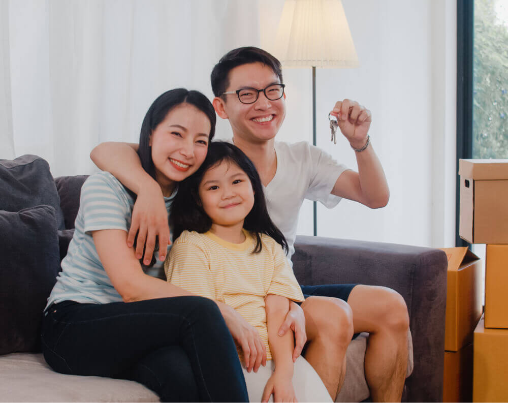 Couple with child getting keys - house fengshui singapore